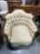 PAIR OF COMPLIMENTARY OVERSIZE FRENCH-STYLE CARVED LOUNGE CHAIRS