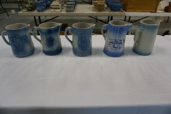 (5) BLUE DECORATED STONEWARE PITCHERS, SOME CHIPS, ONE WITH GRAPE PATTERN,