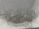 (3) CUT GLASS PITCHERS, (1) CUT GLASS DISH, SOME CHIPS