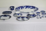 LOT OF FLOW BLUE CUPS, SAUCERS, BUTTER PATS, SERVING PLATTER, (3) SMALL PL