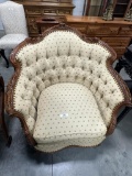PAIR OF COMPLIMENTARY OVERSIZE FRENCH-STYLE CARVED LOUNGE CHAIRS