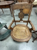 WALNUT VICTORIAN ARMCHAIR WITH CANED SEAT AND CARVING