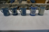 (5) BLUE DECORATED STONEWARE PITCHERS, SOME CHIPS, ONE WITH GRAPE PATTERN,