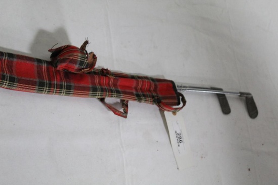 RED PLAID BAG AND 2 TOY CLUBS