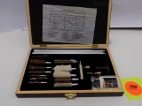 Gun cleaning kit in a wooden organizer box Appears unused or minimal use