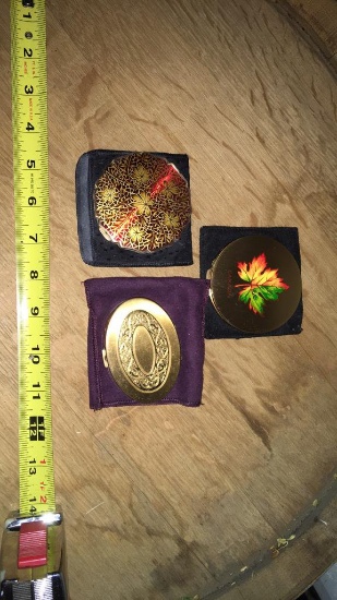 Three powder compact