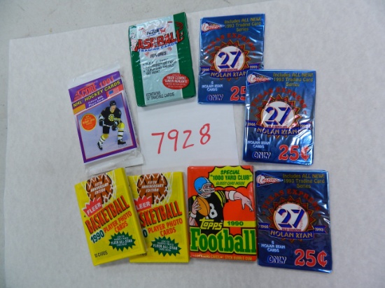 Eight (8) assorted unopened packs: 1990 Fleer Basketball, 1990 Topps Football, 1991 Score Hockey