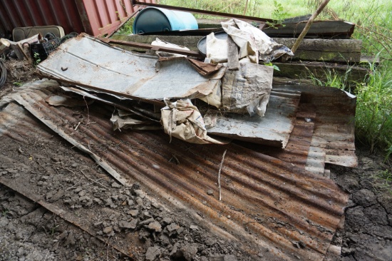 Pile of Railroad Ties and Rusty Tin