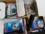 Four (4) X the Money: Untested Digital Cameras, Estate Find (2) Canon Powershot and (2) Sanyo. AS-IS