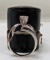 $2515 Appraisal Value: Ladies 14K White Gold Prong and Channel Set containting (1) Round shaped