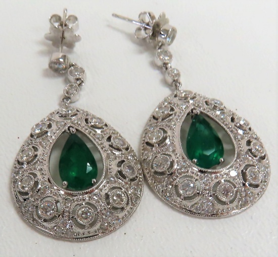 18KT White Gold Pair of Earrings mounted with 2 Emeralds & 108 Diamonds. $30,366 Retail Appraisal