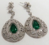 18KT White Gold Pair of Earrings mounted with 2 Emeralds & 108 Diamonds. $30,366 Retail Appraisal