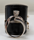 $2515 Appraisal Value: Ladies 14K White Gold Prong and Channel Set containting (1) Round shaped