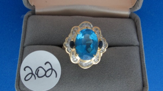 14K y/g Oval Blue Topaz with 2 Marquise