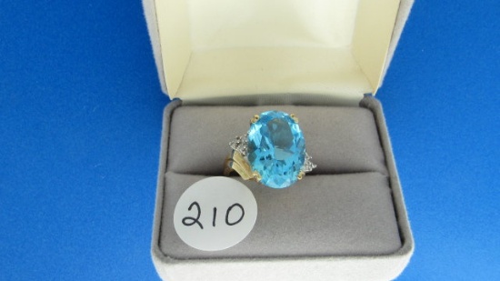 10K y/g 18X13mm blue topaz & 6 diamond ring