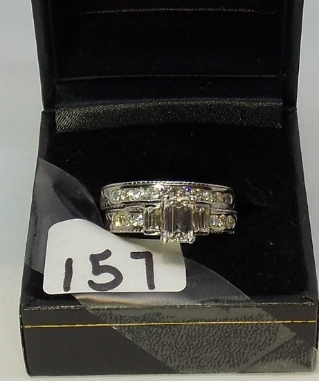 LADIES 14K W/G  .1CT EMERALD CUT CENTER DIAMOND ONE WITH EMERALD CUT SIDE DIAMONDS AND CHANNEL  SET