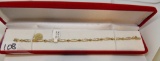 LADIES 14K Y/G 1CT T.W. BAGUETTE TENNIS BRACELET 7.7GR