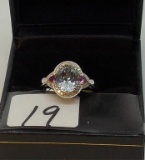 LADIES 10K W/G OVAL BLUE TOPAZ CENTER .14CT T.W. DIAMOND