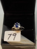 LADIES 18K W/G  .74CT CENTER OVAL SAPPHIRE WITH .26CT TW DIAMOND AROUND RING 4GR