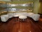 Sofa and (4) chairs - white vinyl - w/42in dia. Coffee table and