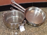 (3) Stainless frying pans and (1) Dutch oven