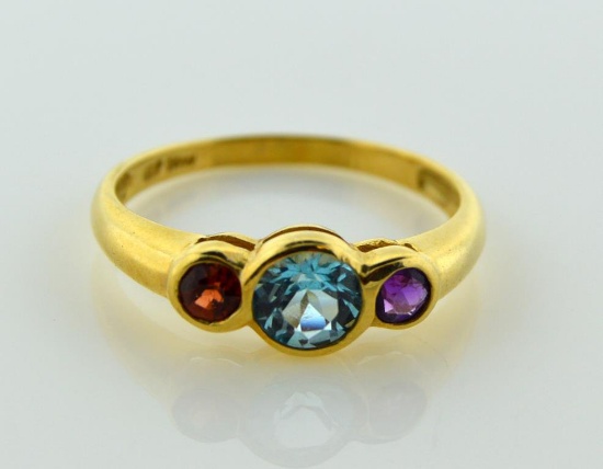 Ladies Size 7 Ring: 10K Yellow Gold, Blue Topaz, Amethyst, Garnet