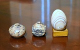 Two Carved Stone Boxes and A Marble Egg On Stand