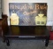 Coffee Table and Bungalow Bath Designs Sign