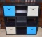 Black Nine Compartment Storage Shelf With 4 Blue or Tan Cloth Baskets