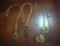 Lot of 4 Costume Jewelry Necklaces: Sun, Chain, Elephant Motifs, and Magnifying Glass