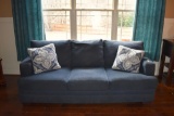 Blue Velour Sofa with Two Accent Pillows