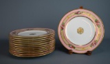 Twelve 8.5” Plates: Central Gilt Medallion, Band of Bouquets on Wider Pink Band