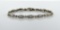 14K White & Yellow Gold and 2.88 Carats Tapered Baguettes and Round Diamond Link Tennis Bracelet