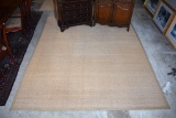 Tan Woven Natural Fiber / Jute 8' 6” x 10' 9” Rug with Cloth Edge