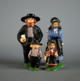 Four Piece Amish Family Painted Cast Iron Figurines