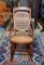 Comfortable Antique Oak Rocker with Caned Back and Seat