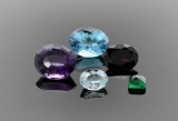 Lot of Five Cut Colored Gemstones: Emerald, Amethyst, Topaz, Aquamarine and Garnet