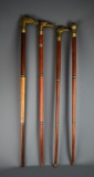 Collection of Four Brass Topped Sectional Canes