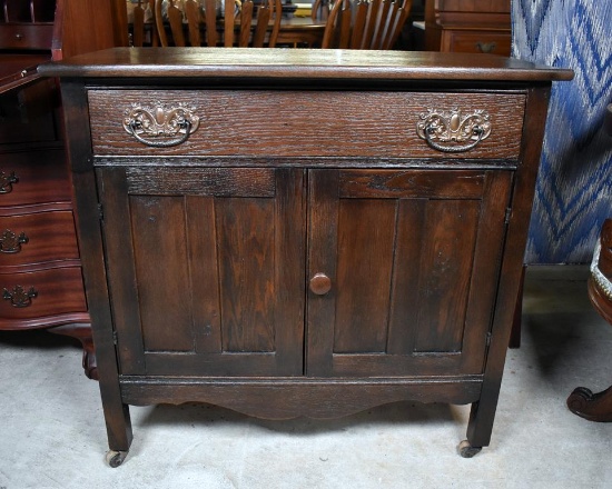 Antique Turn of 20th C. Oak Commode Cabinet with Caster Feet