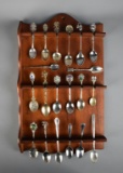 Lot of Silver Plate Collector's Spoons on Wooden Display Rack