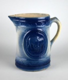 Salt-Glazed Blue/White Stoneware Pitcher with Embossed Scene of Grazing Cattle