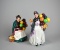 Two Royal Doulton Balloon Seller Figurines: “The Old Balloon Seller” & “Biddy Pennyfarthing” England