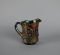 Dugan Carnival Glass “Wreathed Cherry” 4.5” Amethyst Creamer