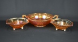Lot of Three Carnival Glass Pieces: Two Jeannette Footed Bowls & Imperial “Optic & Buttons” Bowl