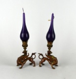 Pair of Antique Bronze Griffin Figural Candleholders w/ Purple Candles