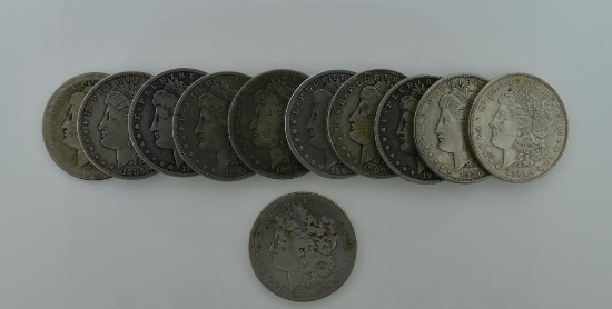 Eleven Morgan Silver Dollars: 1879S, 1882, 1885, 1890O, 1891O, 1899O, 1900O (2), 1901O & 1921 (2)