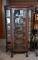 Antique Turn of 20th C. Five-Shelf Oak Curio Cabinet, Paw Feet, Mirrored Back