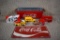 Lot of Seven Coca-Cola Advertising Items: License Plate, Five Small Die-Cast Vehicles, & Tin