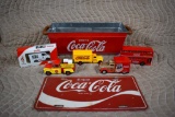 Lot of Seven Coca-Cola Advertising Items: License Plate, Five Small Die-Cast Vehicles, & Tin