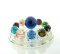 Lot of  Eleven Art Glass Marbles Displayed on Glass Floral Frog